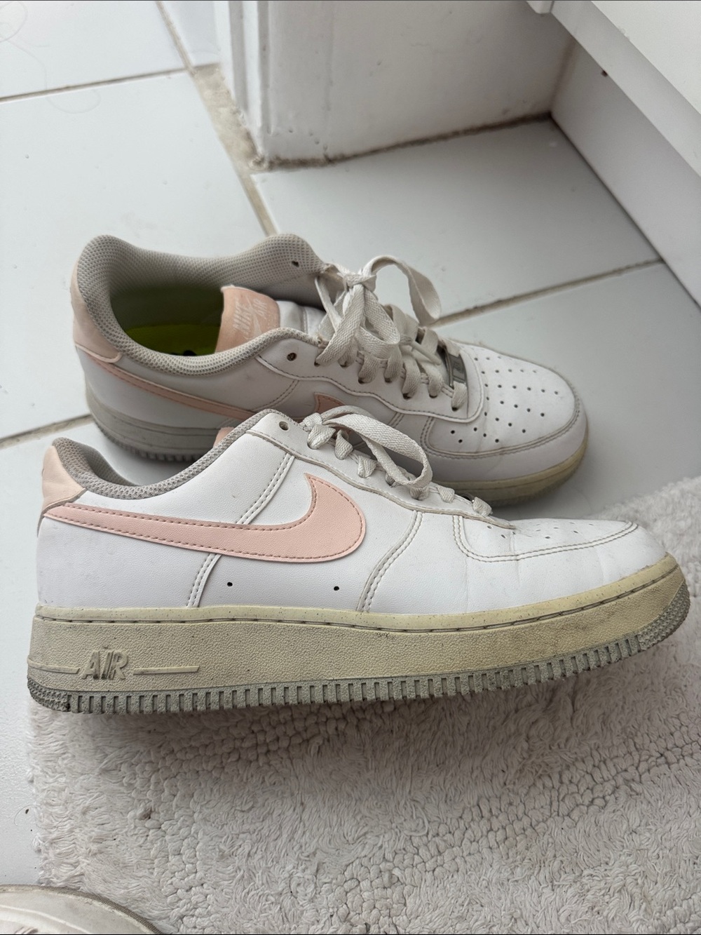 Nike White Low-Top Sneakers with Light Pink Swoosh